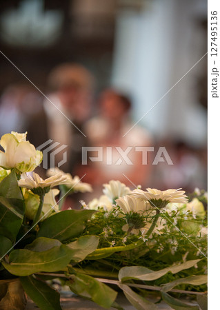 Elegant Wedding Ceremony Flowers with a Blurred Background in a Beautiful Setting 127495136