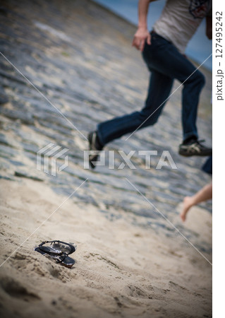 Joyful Day at the Beach Experience the Exciting Jumping Fun and Pure Relaxation 127495242