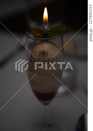 An Elegant and Delightful Dessert with a Candle in a Glass for Special Celebrations An Elegant and Delightful Dessert with a Candle in a Glass for Special Celebrations 127495253