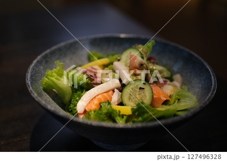 salad with avocado and red fish Salad shrimp vegetables shrimp salad greens vegetables and crayfish in the restaurant 127496328