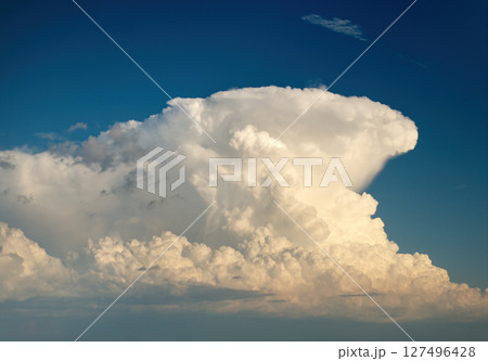 Rain clouds forming on blue Florida sky. Colorful summer skyscape 127496428