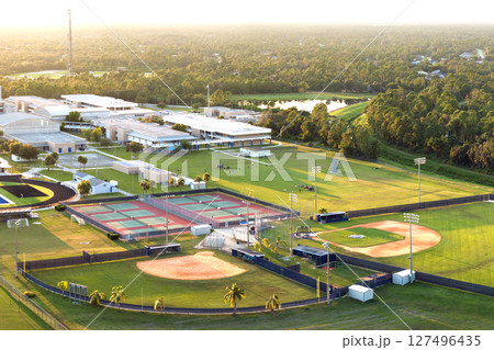 Public high school sports facilities in Florida. American football stadium, tennis courts and baseball diamond sport infrastructure 127496435