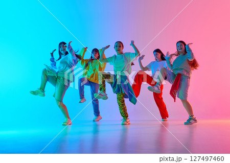 Youthful energy through dynamic urban dance expression in diverse performing arts team spirit 127497460