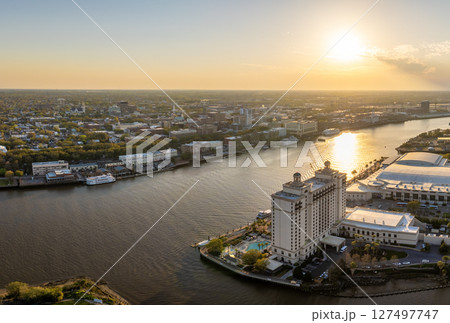 Historical American city architecture at night. River Street in Savannah, old city in Georgia state. Illuminated streets and buildings from above Historical American city architecture at night. River Street in Savannah, old city in Georgia state. Illuminated streets and buildings from above 127497747