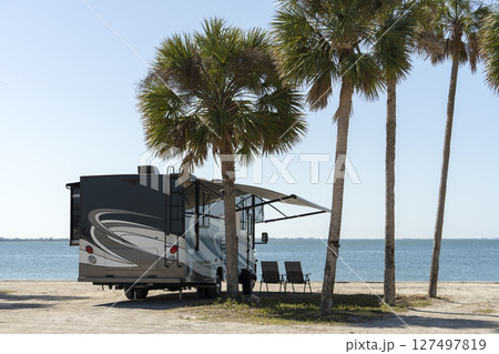 Florida travel destination. Motorhome recreational vehicle on seaside. Florida travel destination. Motorhome recreational vehicle on seaside. 127497819