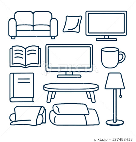 Cozy living room elements including sofa, pillows, books, and lamp create warm atmosphere 127498415