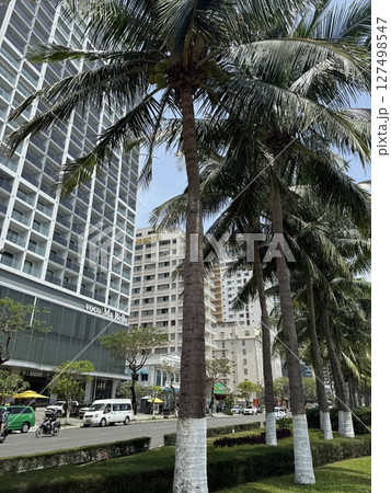 vertical photos vietnam danang beach Beautiful My Khe beach from drone in Da Nang, Vietnam, street and buildings near the Central beach and the sea. Photo from a drone 127498547