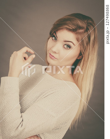 Confused young blonde woman looking annoyed Confused young blonde woman looking annoyed 127498868