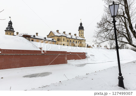 Landscape photo featuring a historic castle against a winter snowy backdrop 127499307
