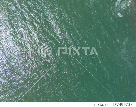 Smooth green color ocean surface Smooth green color ocean surface 127499738