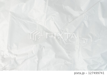 Crumpled white paper background Crumpled white paper background 127499741