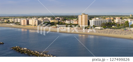 Drone view of Lido Adriano sandy beaches with umbrellas and gazebos 127499826