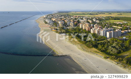 Drone view of italian sandy beaches with umbrellas and gazebos 127499829