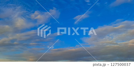 Evening sky with yellowish-gray clouds. 127500037