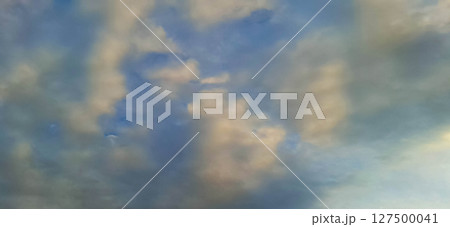 Evening sky with yellowish-gray clouds. 127500041