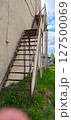 Metal staircase to the second floor on the side of the building. 127500069