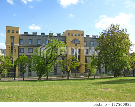 Modern architecture in Lodz. Building with dark glass windows. Office building Modern architecture in Lodz. Building with dark glass windows. Office building 127500983