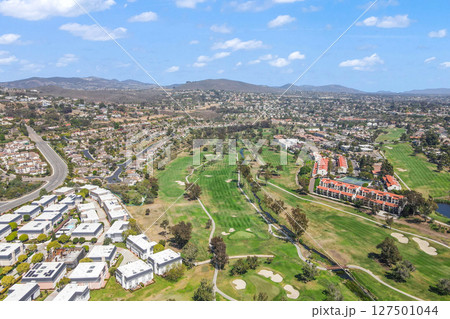 Aerial view of golf surrounded by villas and condos with golf in Carlsbad, North County San Diego 127501044