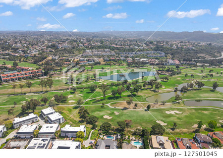 Aerial view of golf surrounded by villas and condos with golf in Carlsbad, North County San Diego 127501045