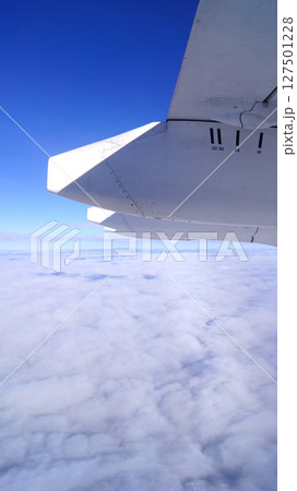 Zurich, Switzerland, April 15, 2015: Inflight View with Wing and Engines 127501228