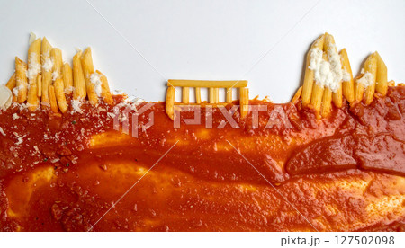Italian pasta bridge spanning tomato sauce river with Parmesan snow capped mountains. Generated Image 127502098