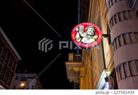 Prague, Czech Republic, August 4, 2023. Night shot highlighting the illuminated sign of a brewery with the most popular brand in the country. Prague, Czech Republic, August 4, 2023. Night shot highlighting the illuminated sign of a brewery with the most popular brand in the country. 127502435