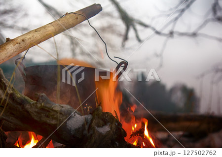 picnic in winter on nature of a bonfire picnic in winter on nature of a bonfire 127502762