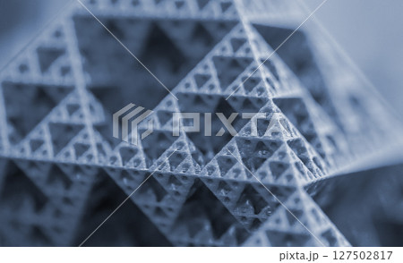 Small model of pyramid printed on 3D printer close-up. Object created on 3D printer from molten plastic. 3D printing technology. Additive modern new progressive technologies. FDM technology Blue color 127502817