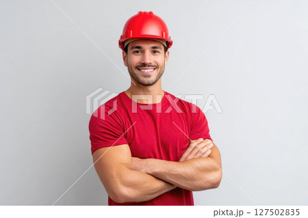 Smiling Construction Worker in Red Helmet Smiling Construction Worker in Red Helmet 127502835