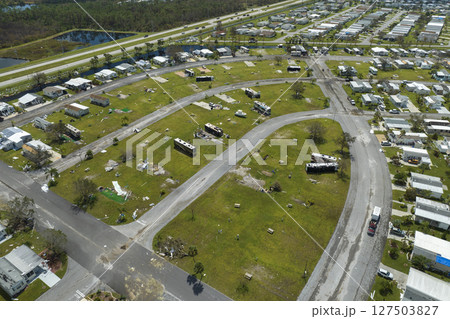 Destroyed RV camper vans and and mobile homes after hurricane in Florida residential area. Consequences of natural disaster 127503827