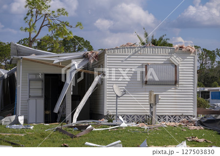 Destroyed by hurricane suburban houses in Florida mobile home residential area. Consequences of natural disaster 127503830