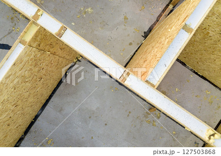 Construction of new and modern modular house. Walls made from composite wooden sip panels with styrofoam insulation inside. Building new frame of energy efficient home concept. 127503868