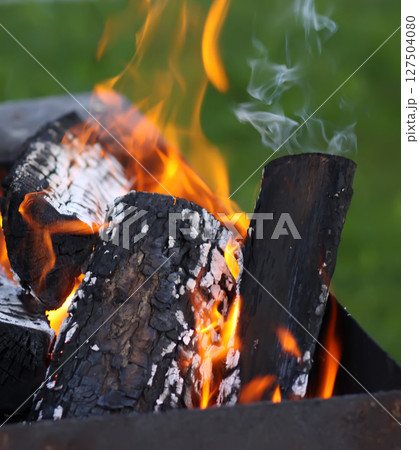 Burning fire in the brazier. 127504080