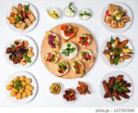 Assorted Appetizers on White Background 127505890