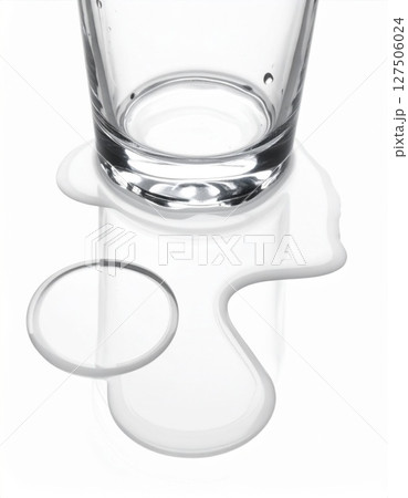 Spilled Water on a White Surface Near Glass 127506024