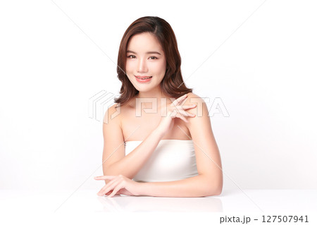 A beautiful young Asian woman with clean, fresh skin against a white background. Skincare, facial treatment, cosmetology, beauty, and spa. An elegant portrait of an Asian woman. A beautiful young Asian woman with clean, fresh skin against a white background. Skincare, facial treatment, cosmetology, beauty, and spa. An elegant portrait of an Asian woman. 127507941