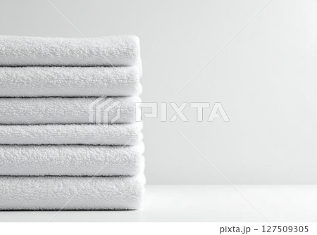 Stack of White Bath Towels on White Background 127509305