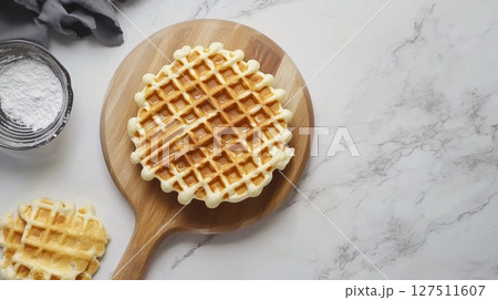 Gluten free flour ingredient waffle crunchy breakfast cake on wooden board 127511607