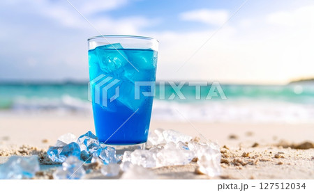 Refreshing cold drinks like cocktails and water shimmer on a tropical beach, embodying summer refreshment under the blue sea and sky 127512034