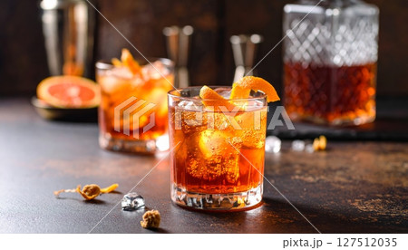 Cold refreshing cola with ice and a lemon slice Cold refreshing cola with ice and a lemon slice 127512035