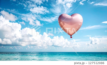 A romantic red heart balloon floats in the blue sky, a symbol of love on Valentine's Day 127512086