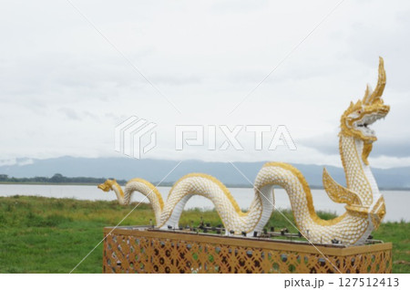 Naka giant snake sculpture beside of Kwan Phra Yao lake, North of Thailand 127512413