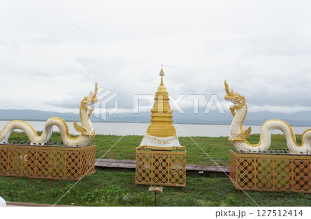 Naka giant snake sculpture beside of Kwan Phra Yao lake, North of Thailand Naka giant snake sculpture beside of Kwan Phra Yao lake, North of Thailand 127512414