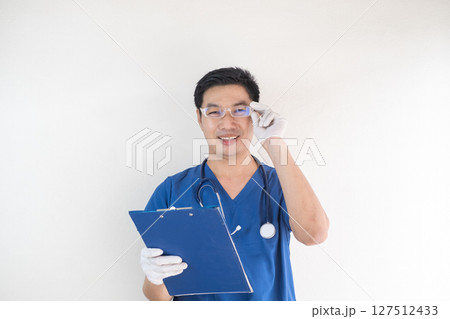 Asian Male Nurse Wearing Glasses and Holding Clipboard 127512433