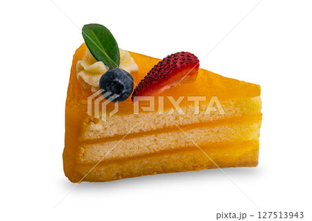 A slice of homemade orange layered cake topped with piece of strawberry, blueberry green leaf and white cream. A slice of homemade orange layered cake topped with piece of strawberry, blueberry green leaf and white cream. 127513943