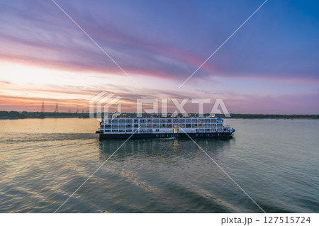 Nile River Cruise Passing Esna Lock Aswan Egypt at Sunset. 127515724