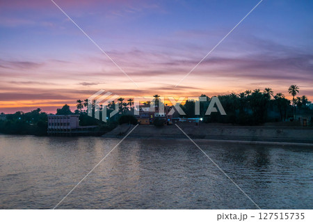 Nile River Dusk Aswan Egypt Local Houses and Lights. Nile River Dusk Aswan Egypt Local Houses and Lights. 127515735