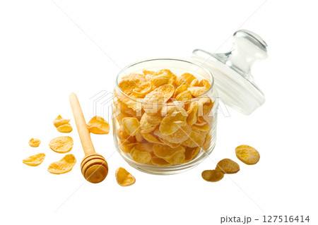 Jar of cornflakes with honey, isolated on white background Jar of cornflakes with honey, isolated on white background 127516414