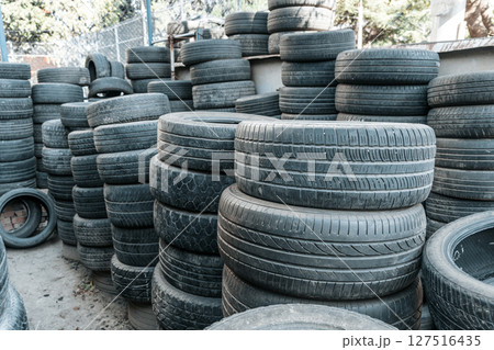 Used Worn Out Car Tires Piled Outdoors 127516435
