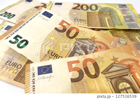 Euro banknotes in various denominations, close-up shot highlighting design and security details, finance concept Euro banknotes in various denominations, close-up shot highlighting design and security details, finance concept 127516539
